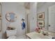 Bathroom with vanity, decorated with beach themed wall art and decorations at 24 Frigate Ct., Pawleys Island, SC 29585