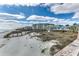Picturesque beach landscape showcasing a scenic boardwalk leading to the sandy shore and ocean, with beautiful community buildings at 24 Frigate Ct., Pawleys Island, SC 29585