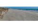 Expansive beach area with soft sand and gentle waves, perfect for leisurely strolls and enjoying the beauty of the ocean at 24 Frigate Ct., Pawleys Island, SC 29585