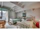 Cozy bedroom with two twin beds, private access to the outdoor balcony with serene views at 24 Frigate Ct., Pawleys Island, SC 29585