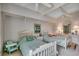 Bright bedroom with two twin beds, coastal accents, and a ceiling fan for added comfort at 24 Frigate Ct., Pawleys Island, SC 29585
