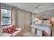 Charming bedroom with a comfortable bed, matching armchair and ample closet space at 24 Frigate Ct., Pawleys Island, SC 29585