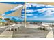 Scenic deck area with tables and seating, perfect for enjoying the ocean view and the refreshing sea breeze in a serene setting at 24 Frigate Ct., Pawleys Island, SC 29585