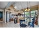Well-lit kitchen and dining area with stainless steel appliances and vaulted ceilings at 24 Frigate Ct., Pawleys Island, SC 29585