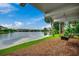 Relaxing backyard with views of the water surrounded by green landscaping at 24 Frigate Ct., Pawleys Island, SC 29585