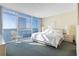 Ocean view bedroom with king bed, side tables, lamps, and a comfortable chair at 2511 S Ocean Blvd. S # 1802B, Myrtle Beach, SC 29577