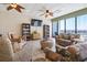 Relaxing lounge area with cozy seating, bookcases, and ocean view windows at 2511 S Ocean Blvd. S # 1802B, Myrtle Beach, SC 29577