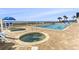 A relaxing pool and hot tub area with palm trees and lounge chairs, perfect for soaking up the sun at 2511 S Ocean Blvd. S # 1802B, Myrtle Beach, SC 29577