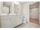 Bathroom features dual sink vanity, tile flooring, and walk in closet at 253 Bent Green Ct. # 70D, Murrells Inlet, SC 29576
