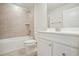 Well-lit bathroom featuring a shower over the tub and a modern vanity with sink at 253 Bent Green Ct. # 70D, Murrells Inlet, SC 29576