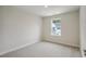 Neutral bedroom features plush carpet and large window at 253 Bent Green Ct. # 70D, Murrells Inlet, SC 29576