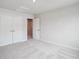 Bedroom with neutral carpet, a closet, and an open doorway at 253 Bent Green Ct. # 70D, Murrells Inlet, SC 29576