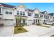 Beautiful townhouses with white siding, blue shutters, and well-manicured landscaping at 253 Bent Green Ct. # 70D, Murrells Inlet, SC 29576