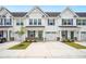 Charming townhouse with white siding, blue shutters, and well-manicured landscaping at 253 Bent Green Ct. # 70D, Murrells Inlet, SC 29576