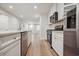 Modern kitchen featuring white cabinets, stainless steel appliances, and bright lighting at 253 Bent Green Ct. # 70D, Murrells Inlet, SC 29576