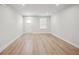 Bright living room with wood-look flooring and a white door at 253 Bent Green Ct. # 70D, Murrells Inlet, SC 29576