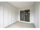 Enclosed patio with white siding, leading to a sliding door for indoor-outdoor flow at 253 Bent Green Ct. # 70D, Murrells Inlet, SC 29576
