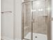 Modern bathroom features a tiled shower with a glass door and bench at 253 Bent Green Ct. # 70D, Murrells Inlet, SC 29576