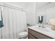 Cozy bathroom featuring a shower with white curtain, toilet and vanity with a sink at 259 Stillbrook Dr., Longs, SC 29568