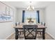 Cozy dining room featuring a wooden table, stylish chairs, and a charming chandelier at 259 Stillbrook Dr., Longs, SC 29568