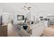 Open concept living space combining a cozy living room with a modern kitchen and dining area at 259 Stillbrook Dr., Longs, SC 29568