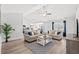 Bright, open living room featuring vaulted ceilings, neutral decor, and modern furnishings at 259 Stillbrook Dr., Longs, SC 29568