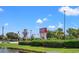 Shops at the Tanger Outlets with a pond in the foreground and lush landscaping at 259 Stillbrook Dr., Longs, SC 29568