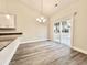 Dining room features sliding glass doors to the backyard and a modern chandelier at 2593 Main St., Loris, SC 29569
