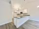 Kitchen island with granite countertop and sink, with modern cabinets and stainless appliances at 2593 Main St., Loris, SC 29569