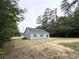 A partial view of the back of the property with some minor landscaping at 2593 Main St., Loris, SC 29569