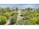Aerial view of the community's serene neighborhood near the water, showcasing beautiful homes and lush landscaping at 2604 South Bay St., Georgetown, SC 29440
