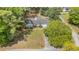 Aerial view of a quaint home with mature trees, a well-kept lawn, and a paved driveway at 2604 South Bay St., Georgetown, SC 29440