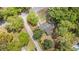 An aerial view of a charming home nestled among lush trees in a peaceful neighborhood at 2604 South Bay St., Georgetown, SC 29440