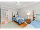 Neutral bedroom featuring two twin beds, hardwood floors, and a ceiling fan at 2604 South Bay St., Georgetown, SC 29440