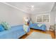 Bedroom featuring two beds, hardwood floors, windows, and a ceiling fan at 2604 South Bay St., Georgetown, SC 29440