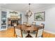 Dining room featuring a round wooden table, brick fireplace, and built-in shelving at 2604 South Bay St., Georgetown, SC 29440