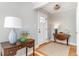 Bright foyer with hardwood floors, stylish furnishings, and a white interior door at 2604 South Bay St., Georgetown, SC 29440