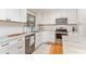 Corner of kitchen showing stainless steel appliances, white cabinets, and marble countertop at 2604 South Bay St., Georgetown, SC 29440