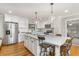 Updated kitchen with marble island, stainless steel appliances, and pendant lighting at 2604 South Bay St., Georgetown, SC 29440