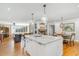 Open concept kitchen with marble island, stainless steel appliances, leading to living room and dining areas at 2604 South Bay St., Georgetown, SC 29440