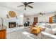 Cozy living room featuring a fireplace, comfortable seating, and hardwood floors at 2604 South Bay St., Georgetown, SC 29440