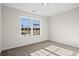 Bright bedroom with neutral walls, carpet flooring, and a large window providing natural light at 263 Stillbrook Dr., Longs, SC 29568