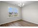 Bright dining room with a chandelier and a view of the lake at 263 Stillbrook Dr., Longs, SC 29568