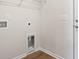 A bright laundry room with a hookup for the washer and dryer and a shelf for storage at 263 Stillbrook Dr., Longs, SC 29568