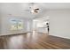 Bright and airy living room with hardwood floors and an open concept kitchen at 263 Stillbrook Dr., Longs, SC 29568