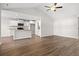 Open-concept living area with hardwood floors, vaulted ceilings, and a modern kitchen at 263 Stillbrook Dr., Longs, SC 29568