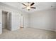 Spacious main bedroom with a ceiling fan and a walk-in closet at 263 Stillbrook Dr., Longs, SC 29568