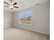 Bright main bedroom with a ceiling fan and a view of the lake at 263 Stillbrook Dr., Longs, SC 29568