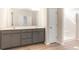 Bathroom featuring dual sinks, spacious vanity with cabinets, and a shower at 268 Stillbrook Dr., Longs, SC 29568