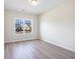A relaxing bedroom with a view through the window, enhanced by the light wood flooring at 268 Stillbrook Dr., Longs, SC 29568